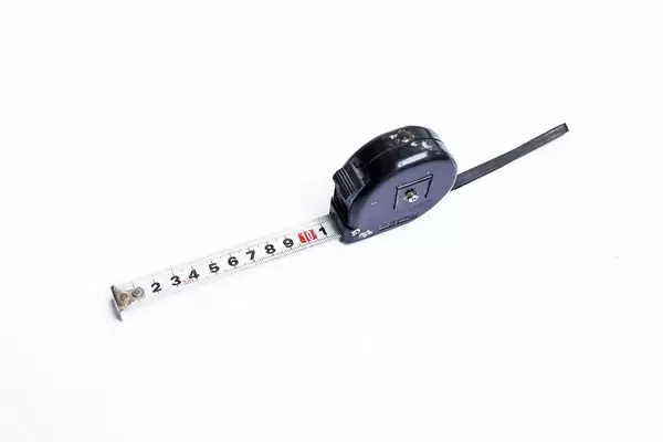 Black tape measure on white background
