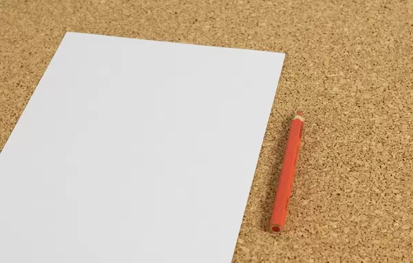 Black white paper with red pencil