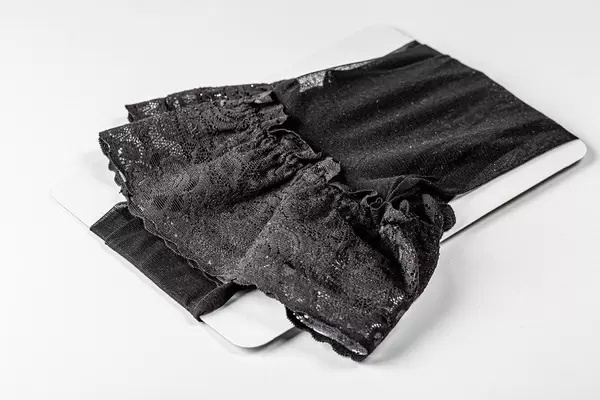 Black women's stockings on a white background (Flip 2020)