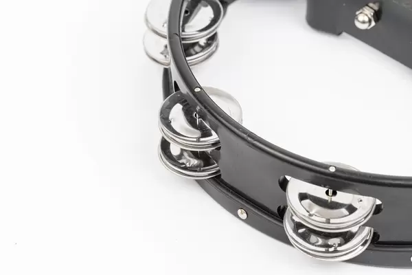 Black wood Tambourine isolated above white background with copy space