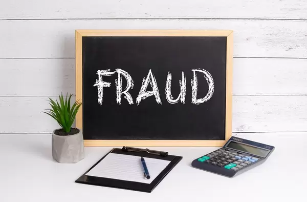 Blackboard with Fraud text
