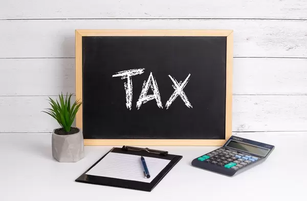 Blackboard with Tax text