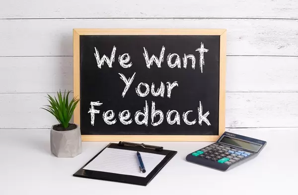 Blackboard with We Want Your Feedback text