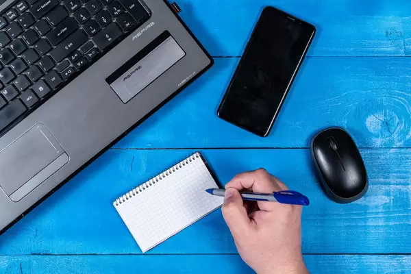 Blank Paper with Copy Space Lap Top and Mobile on the table