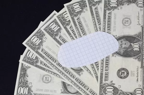 Blank piece of paper and dollar banknotes