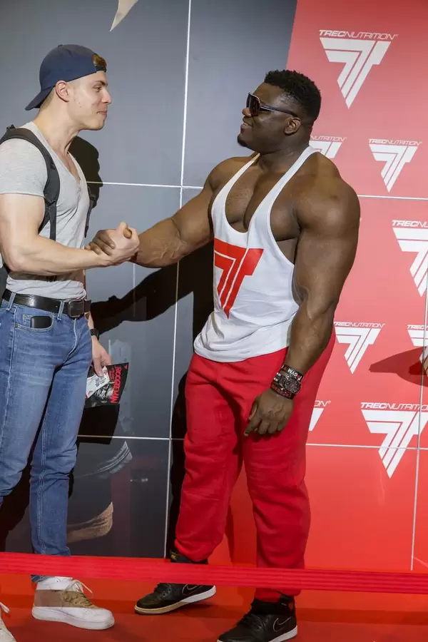 Blessing “The Boogieman” Awodibu shaking hands with a fan - FIBO Cologne 2018