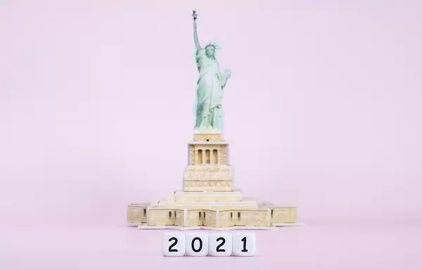 Blocks with 2021 text in front of Statue Of Liberty