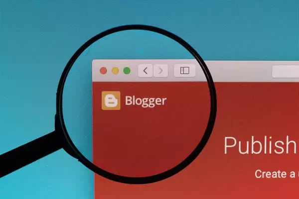 Blogger logo under magnifying glass