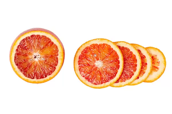 Blood red orange slice on white background