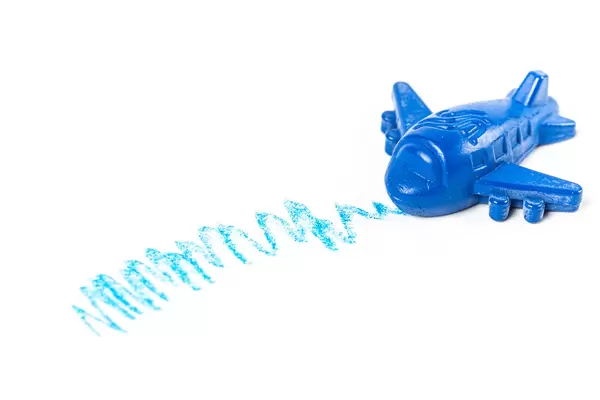 Blue crayon in the shape of an airplane