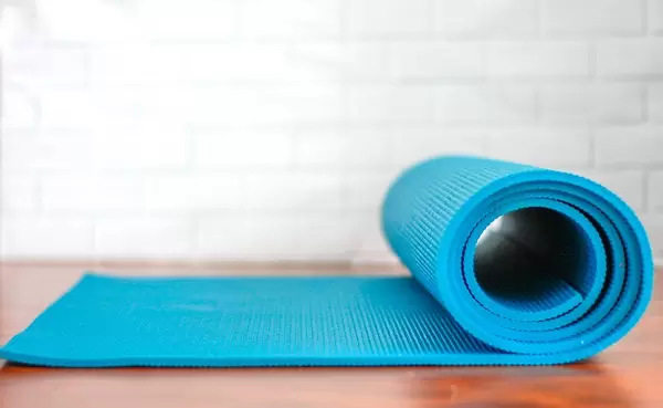 Blue fitness mat for meditation and sports accessories