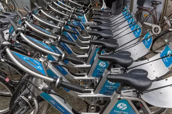 Blue FordPass Bikes in the rain
