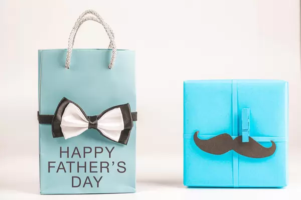 Blue gifts with male attributes - happy father's day concept