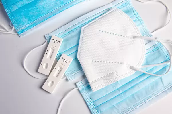 Blue medical face masks with FFP2 mask and Covid-19 Antigen test