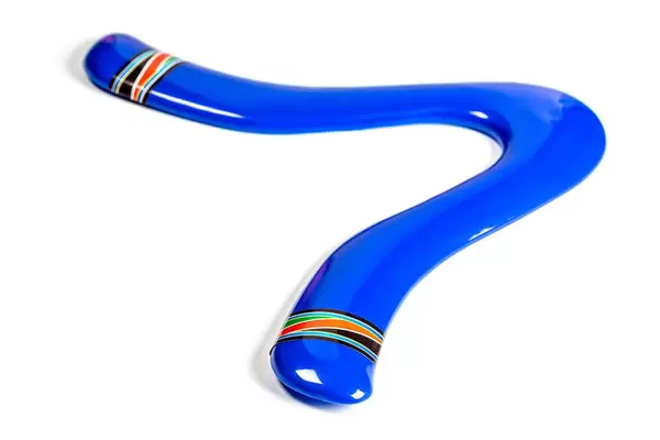 Blue plastic boomerang on white background