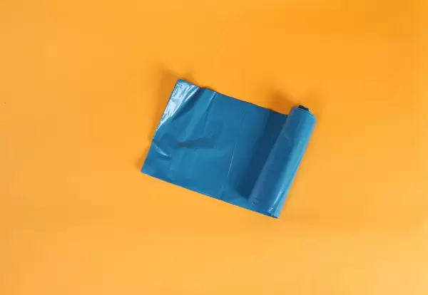 Blue plastic garbage bag roll