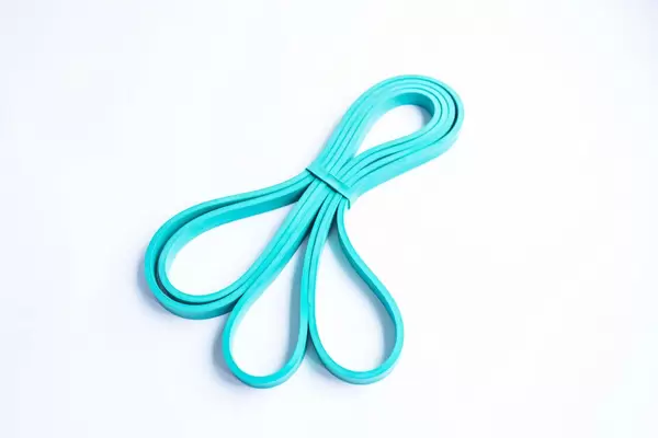 Blue resistance band on white background
