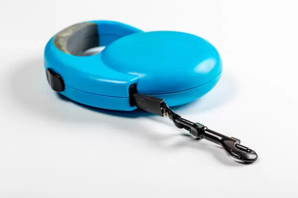 Blue retractable leash for dog top on white background