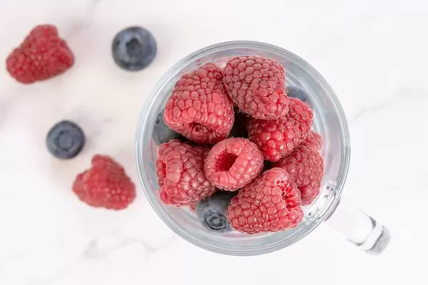Blueberries and Raspberries in the glass