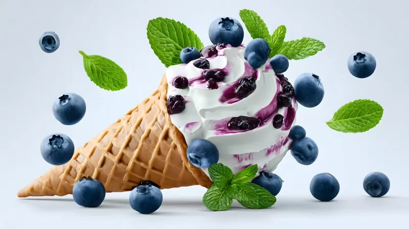 Blueberry swirl ice cream cone with mint leaves