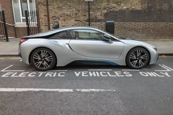 BMW i8 parking on a Electric Vehicles Only Parking Space on the Road with Charging Station