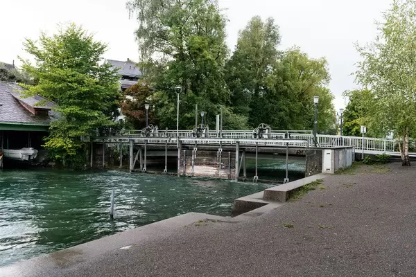 Boat gate under the bridge over a canal in Swiss city Cham