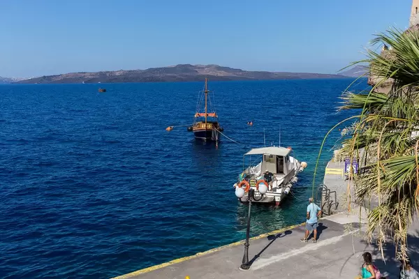 Boats in the not so crowded Aegean Sea in Santorini on a day in July
