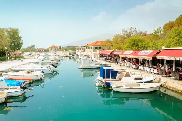 Boats parked in front of a bar in Trogir
