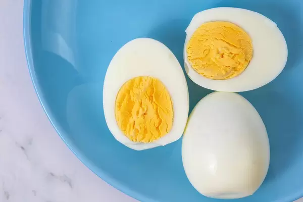 Boiled Chicken Eggs on the blue plate (Flip 2019)