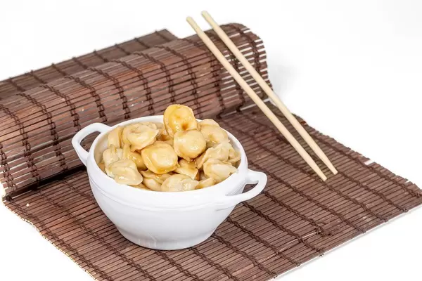 Boiled dumplings with soy sauce and butter