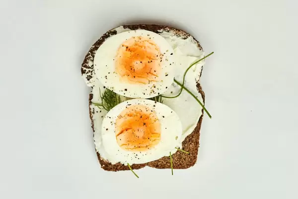 Boiled egg sliced and spiced on the roasted toast