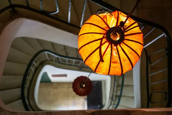 Bokeh Photo of Hanging Lantern Light in a Spiral Staircase in a Building in Vietnam