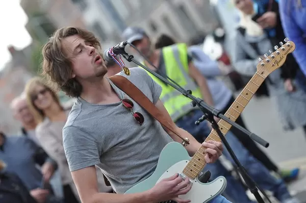 Bokeh Photo of James Lock performing in Dublin with Spectators in the Background