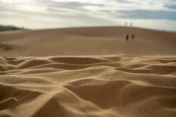 Bokeh Photo of the Red Sand Dunes in Mui Ne with Sunset in the Background