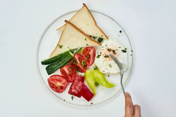 Bon Appetite. A woman having delicious breakfast