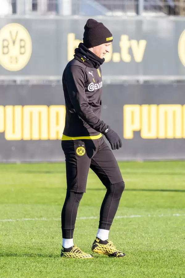 Borussia Dortmund captain Marco Reus in winter training clothes on a sunny day
