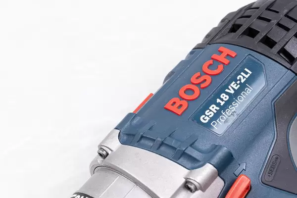 Bosch Acu drill with copy space above white background