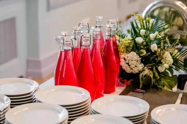 Bottles With Cranberry Juice On the Serving Table