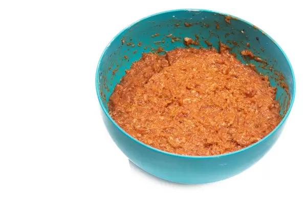 Bowl with meatballs mixture isolated above white background