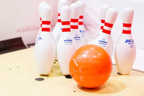 Bowling ball hits pins
