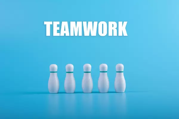 Bowling pins with Teamwork text