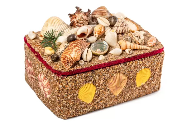 Box in a marine style decorated with seashells on a white background