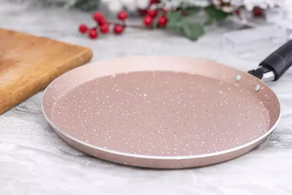 Brand new Frying Pan on the kitchen working board