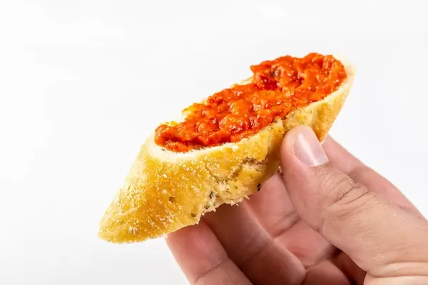 Bread Baguettes with Tomato and Tartar Sauce in the hand (Flip 2019)