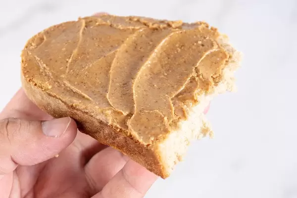 Bread with Peanuts Butter in the hand