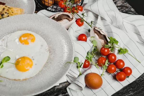 Breakfast Eggs With Tomatoes And White Towel