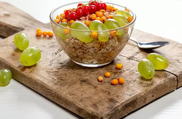 Breakfast with oatmeal and fresh fruit