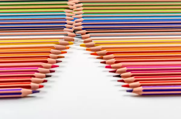 Bright background of many colored pencils