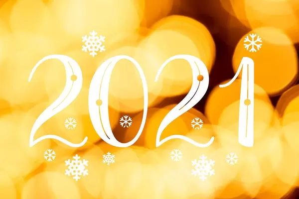 Bright yellow bokeh background, 2021 year greetings concept