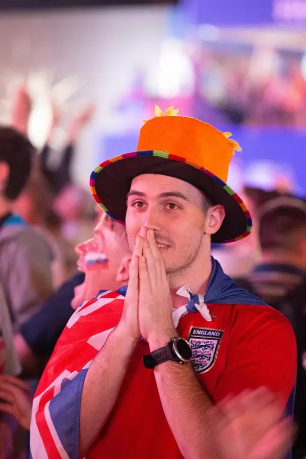 British soccer fan praying